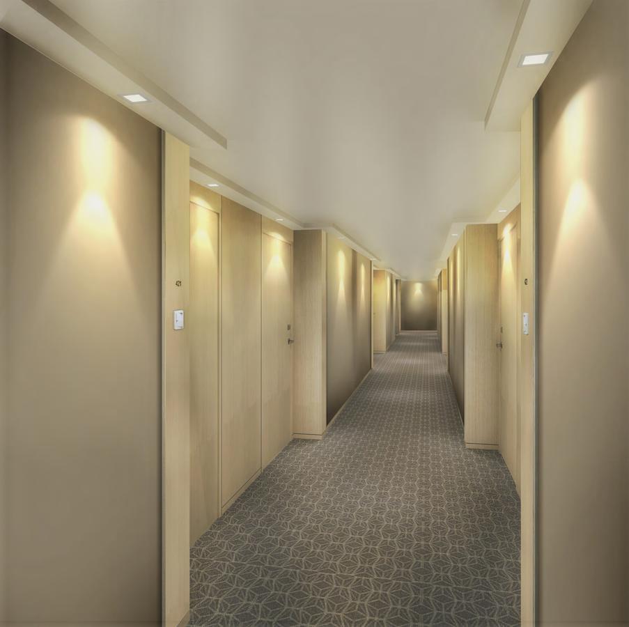 Seda Vertis North Кесон-Сити Экстерьер фото A typical hotel corridor